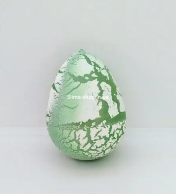 Яйцо с динозавром Орбиз (из гидрогеля, растушка) бело-салатовое 4,5x6 см (40410)